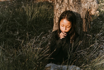 Asian girl praying