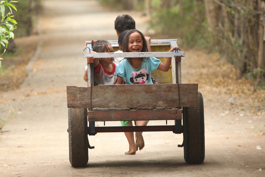 Children playing on cart
