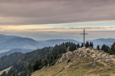 Cross On Hill In Mountains