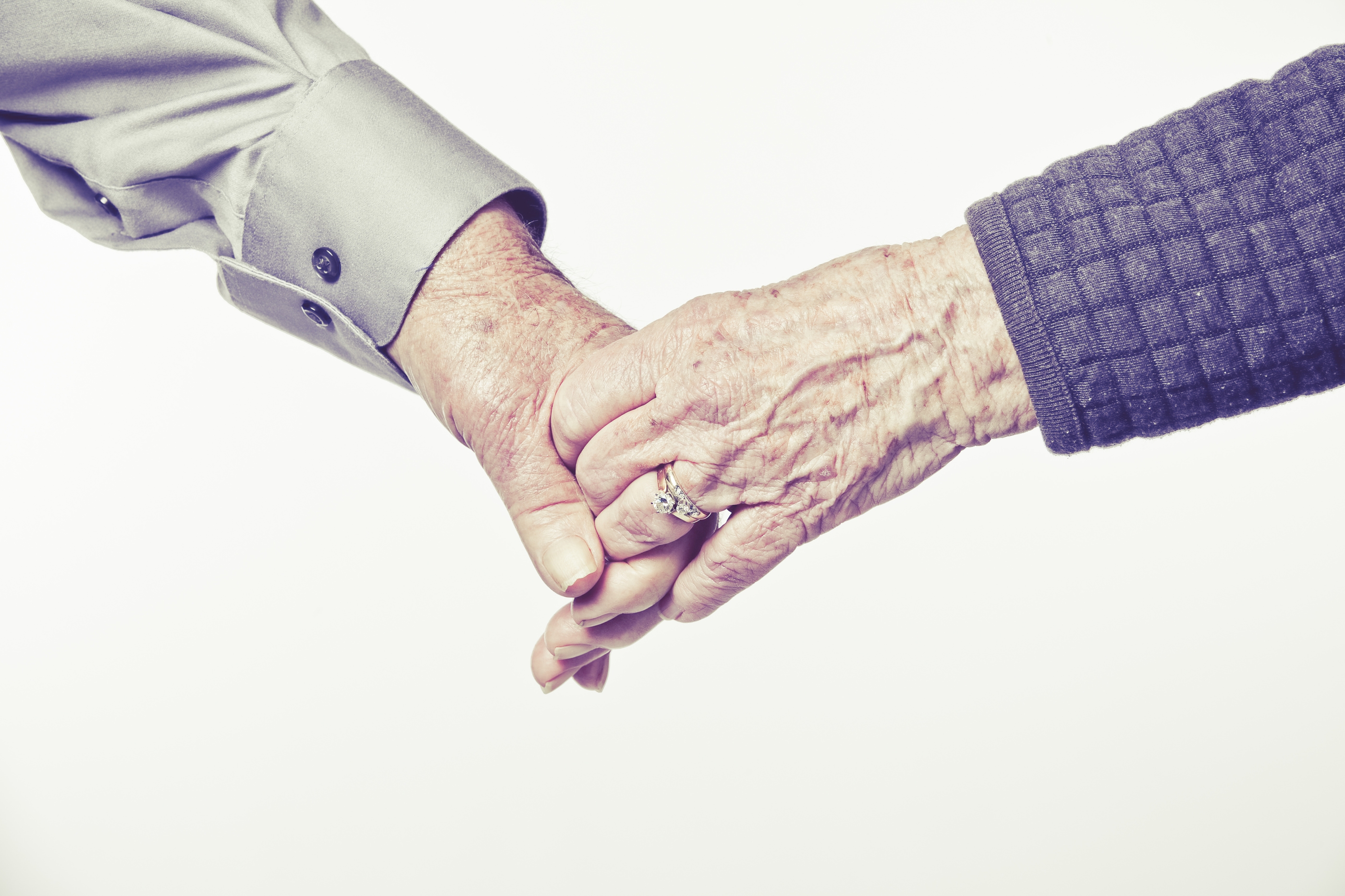 Elderly Couple Holding Hands