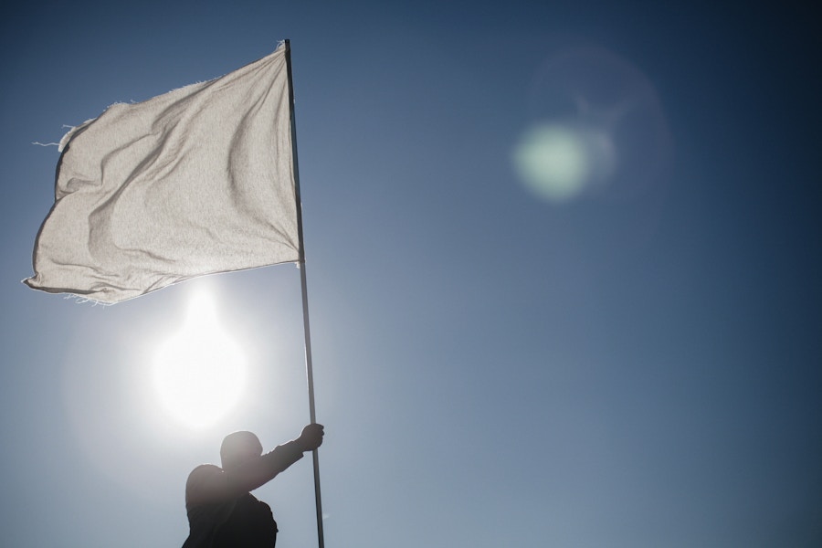 Man Waiving White Flag